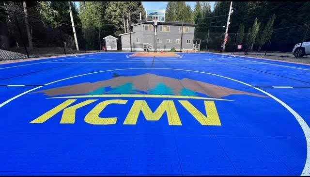 Blue basketball court on a new concrete slab at Khalsa Centre, Miracle Valley